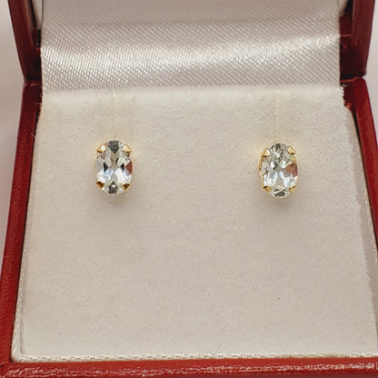 14K Yellow Gold Oval Genuine Aquamarine 6X4mm Stud Earrings