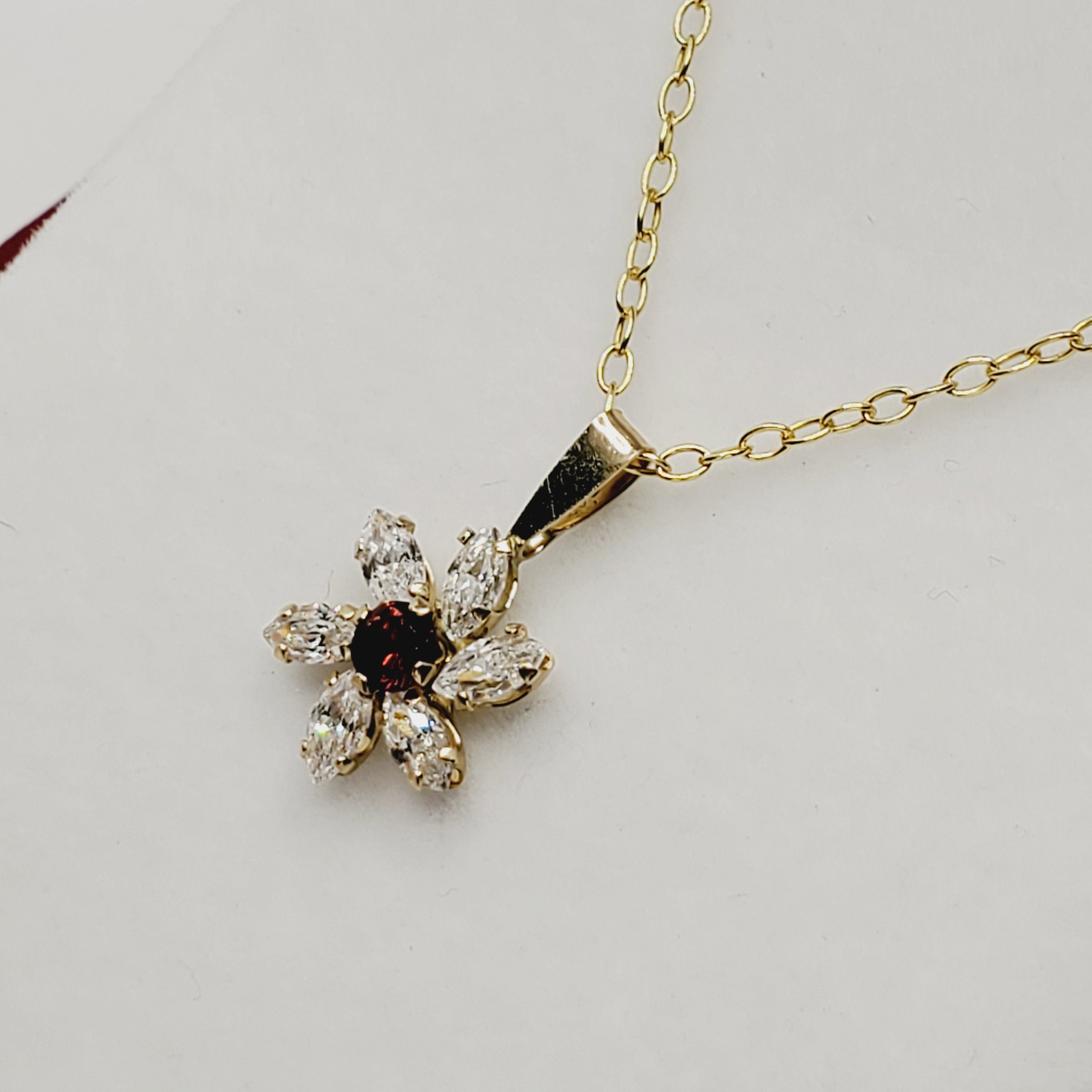 Garnet Starburst Pendant | 10K Yellow Gold Garnet and Cubic Zirconia Pendant