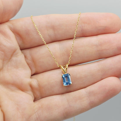 14K Gold Emerald Cut Blue Topaz Pendant Necklace, December Birthstone 7x5mm