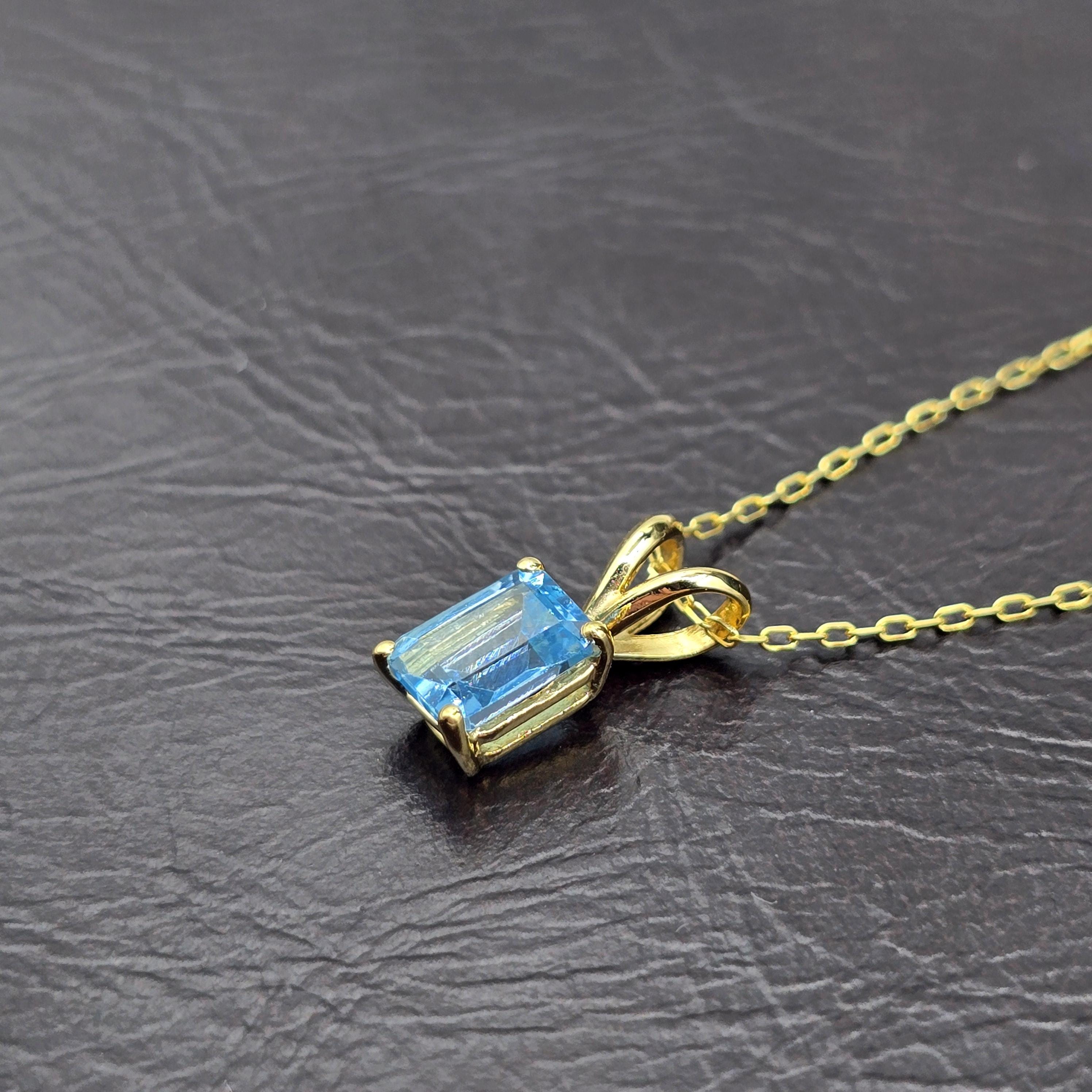 14K Gold Emerald Cut Blue Topaz Pendant Necklace, December Birthstone 7x5mm