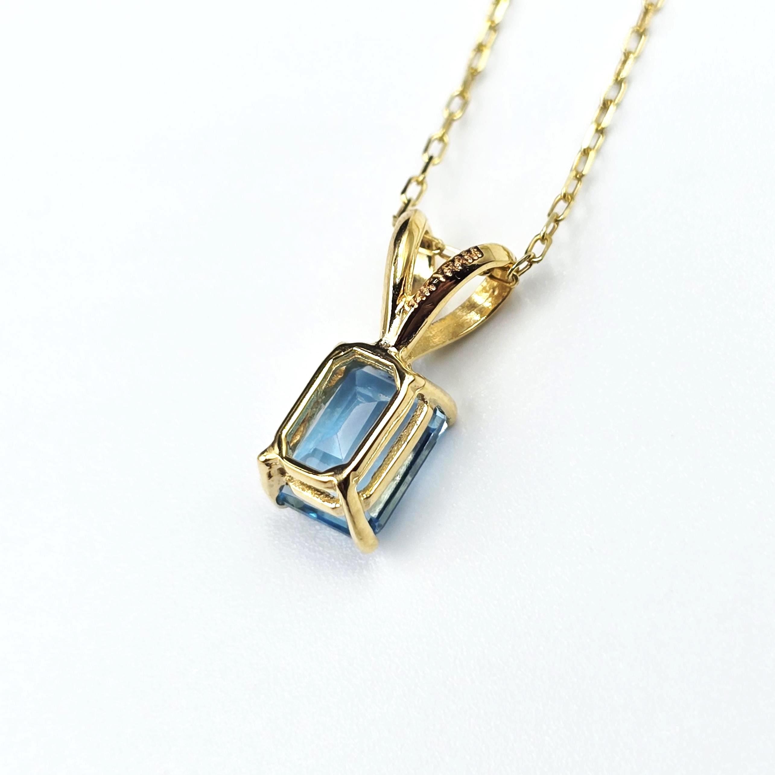 14K Gold Emerald Cut Blue Topaz Pendant Necklace, December Birthstone 7x5mm